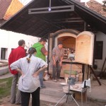 Loading Julia  Nema's wood kiln. mainly with student porcelain pieces