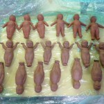 Four different shapes. Still working with the baby image,-changing its posture. Variations on a theme. Trying out different clays.